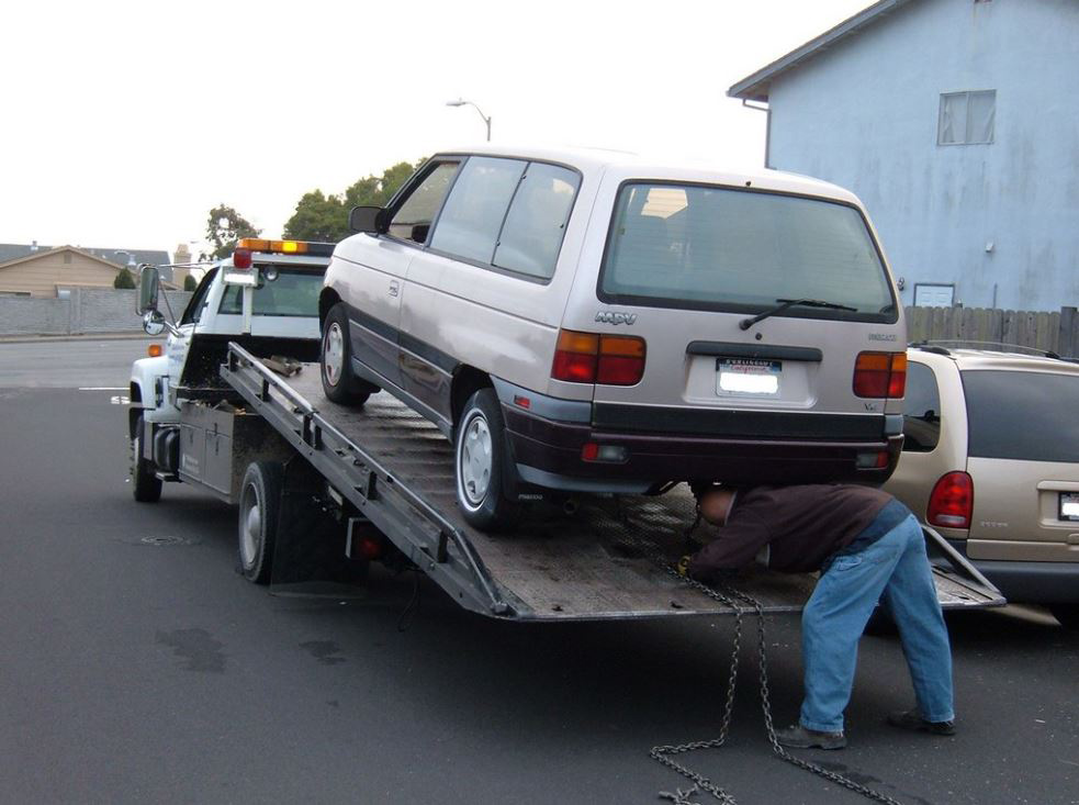 Flatbed Loading A MPV Van On Our Flatbed Tow Truck