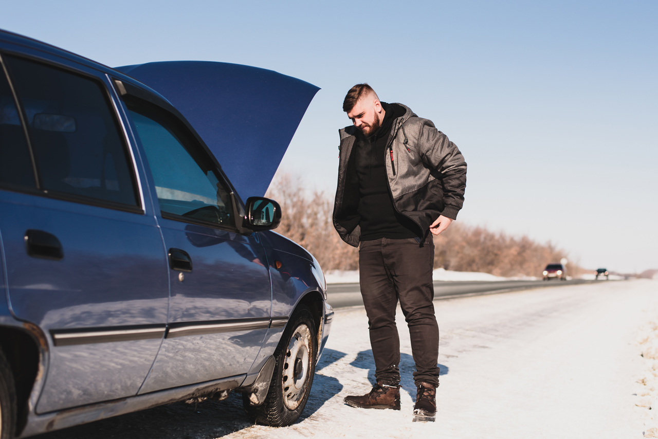 Gentleman in winter needing roadside assistance